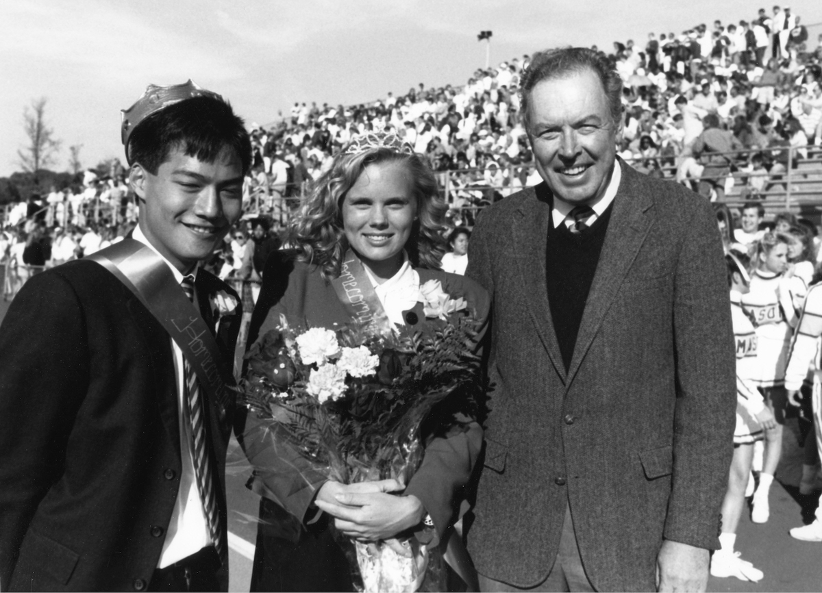 three people in black and white at soccer game