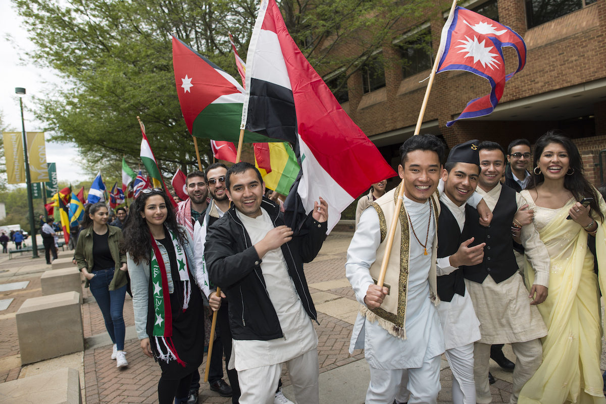 students outside carrying flags