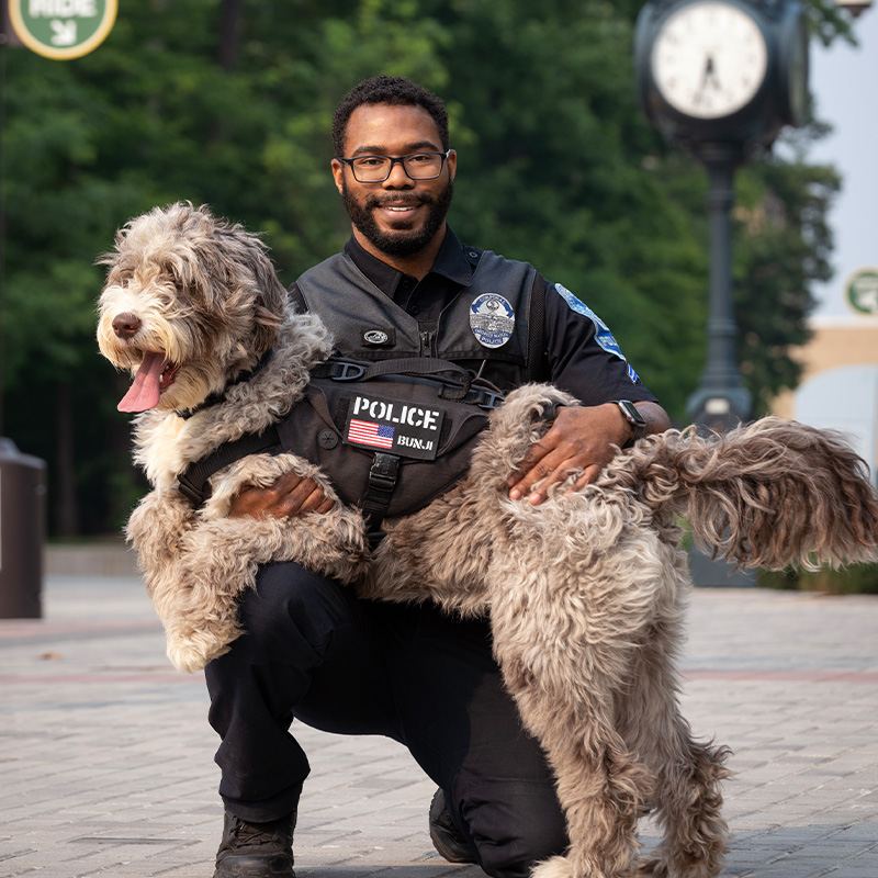 Officer Ashanti Mumin with his K9 partner, Bunji. Photo by Evan Cantwell.