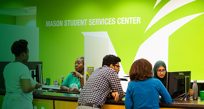 Mason students being helped at the Mason Student Services Center