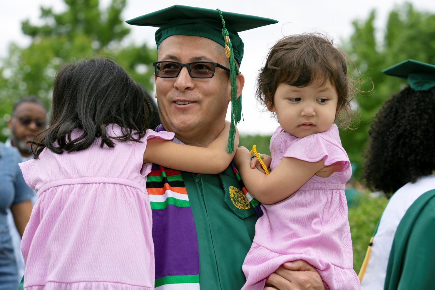 Graduate holds two young children