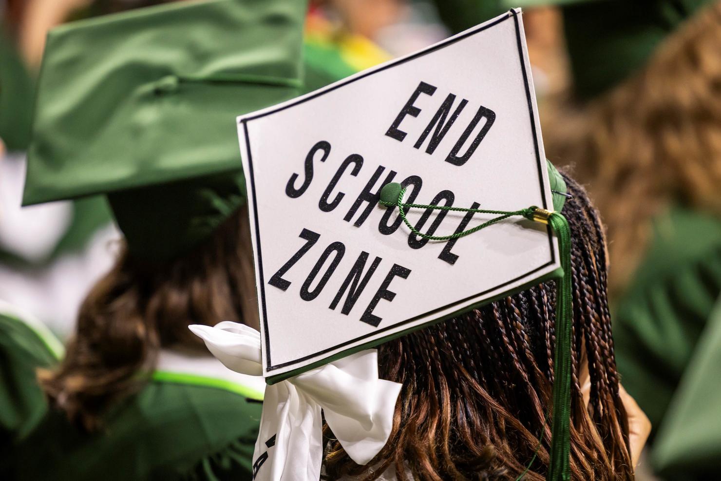 Decorated cap says "end school zone"