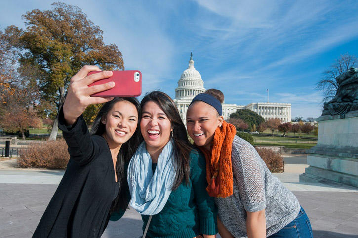 Mason Student Ambassadors taking a selfie in front of the capitol building