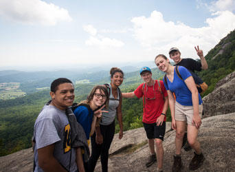 Mason students hiking a mountain