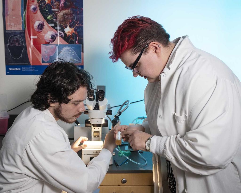 research faculty - professor and student in white lab coats