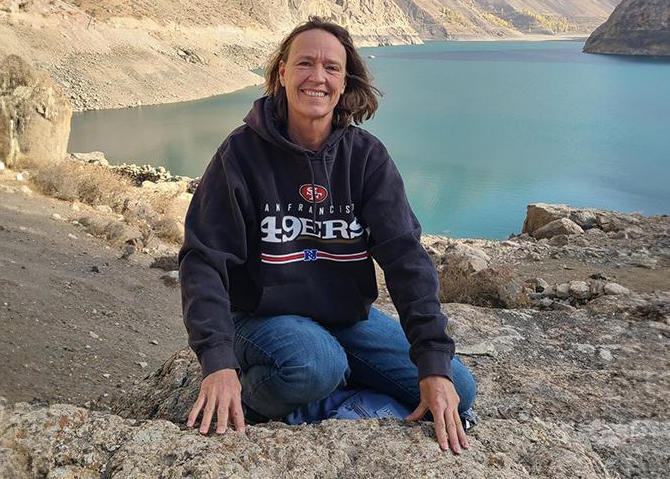 Sue Slocum poses at Lake Tajikistan