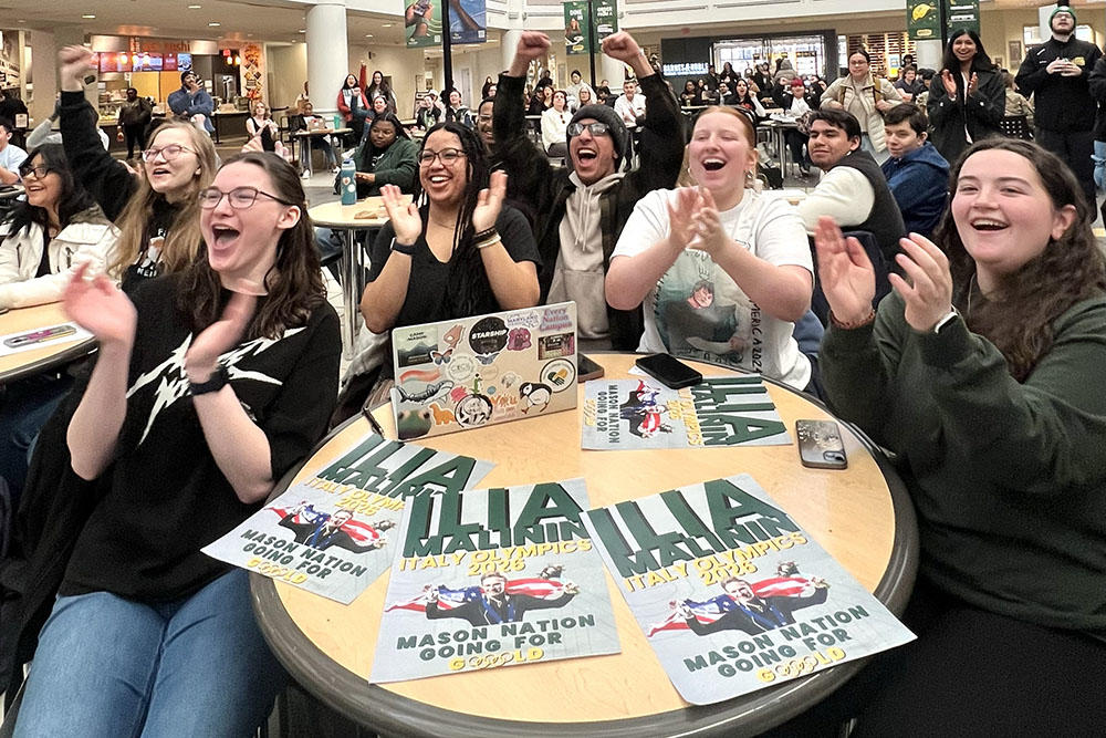 Students in the Johnson Center for an Olympic watch party to cheer on fellow student Ilia Malinin