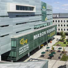 An aerial view of Mason Square, with branded graphics on the building.