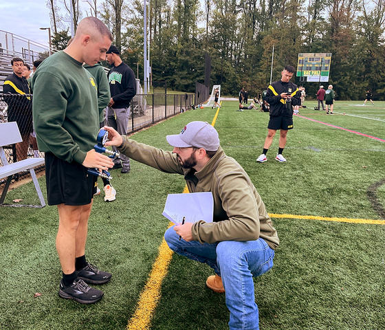 Joel Martin does grip strength testing on an ROTC cadet