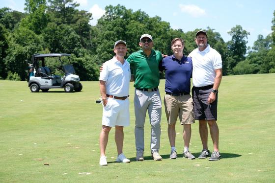 Diversity Golf Classic four men on golf course