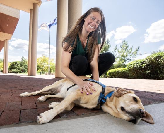 Sam Carrico and Rylynn the therapy dog