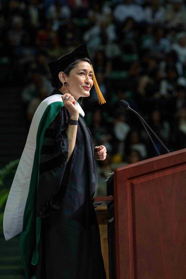 Commencement speaker Martina Cheung addresses the graduates from the podium