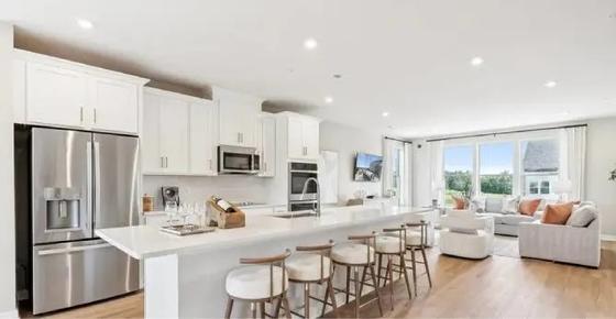 Interior of the SciTech Townhome includes an open-concept kitchen and living area with a large island