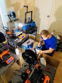 Denys Kuratchenko running a print farm from his apartment.